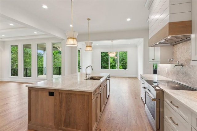 7188 Williams Rd, Flowery Branch, GA 30542 - kitchen featuring a sink, electric range oven, plenty of natural light, light wood-type flooring, and recessed lighting