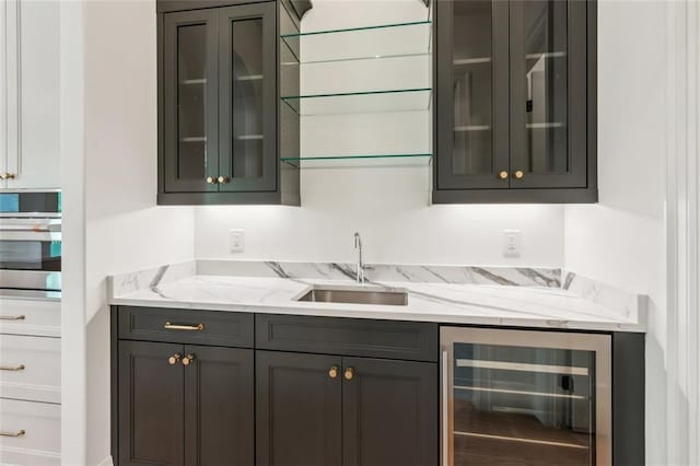 7188 Williams Rd, Flowery Branch, GA 30542 - bar area with wine cooler, a sink, and stainless steel oven