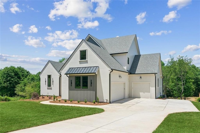 7188 Williams Rd, Flowery Branch, GA 30542 - modern farmhouse featuring an attached garage, a front lawn, concrete driveway, a shingled roof, and a standing seam roof