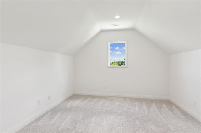 7188 Williams Rd, Flowery Branch, GA 30542 - bonus room with light carpet, lofted ceiling, and baseboards