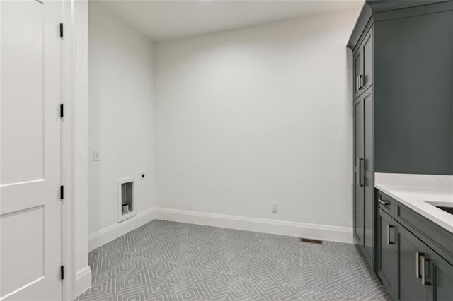 7188 Williams Rd, Flowery Branch, GA 30542 - laundry area with cabinet space, baseboards, electric dryer hookup, and light flooring