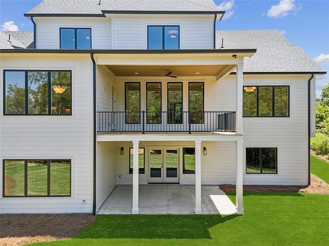 7188 Williams Rd, Flowery Branch, GA 30542 - rear view of house featuring a balcony, french doors, a lawn, a patio, and roof with shingles