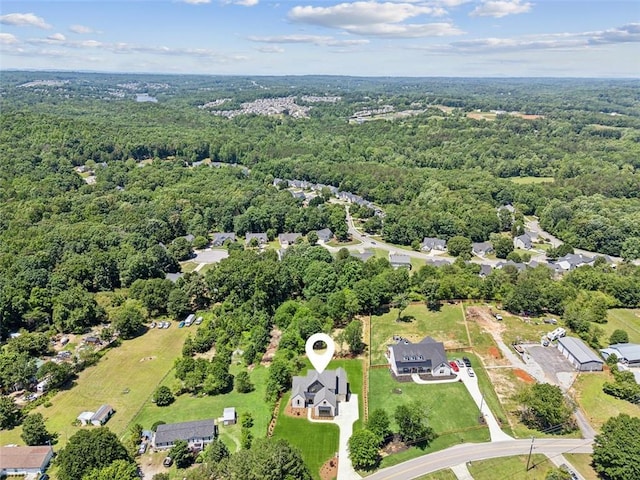 7188 Williams Rd, Flowery Branch, GA 30542 - aerial view of property and surrounding area with a heavily wooded area