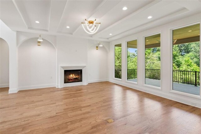 7188 Williams Rd, Flowery Branch, GA 30542 - unfurnished living room with healthy amount of natural light, light wood finished floors, recessed lighting, and baseboards