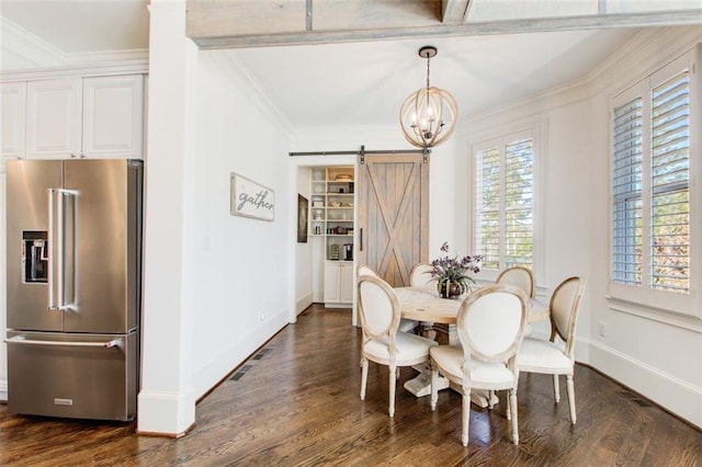 dining area featuring a chandelier, a barn door, dark wood-type flooring, baseboards, and ornamental molding