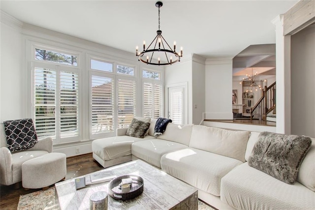 living room with an inviting chandelier, stairs, and a wealth of natural light