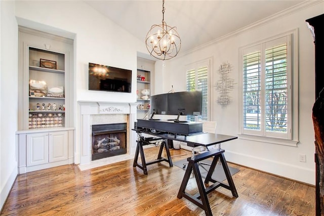 office featuring built in features, a notable chandelier, a fireplace with flush hearth, wood finished floors, and baseboards