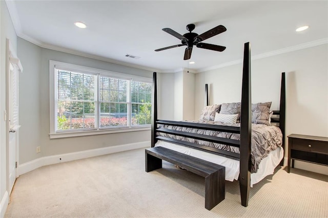 bedroom with light colored carpet, visible vents, crown molding, and baseboards