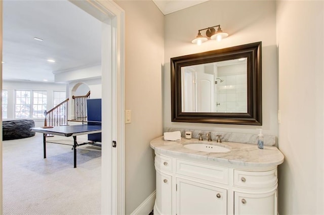 bathroom with recessed lighting, baseboards, and vanity