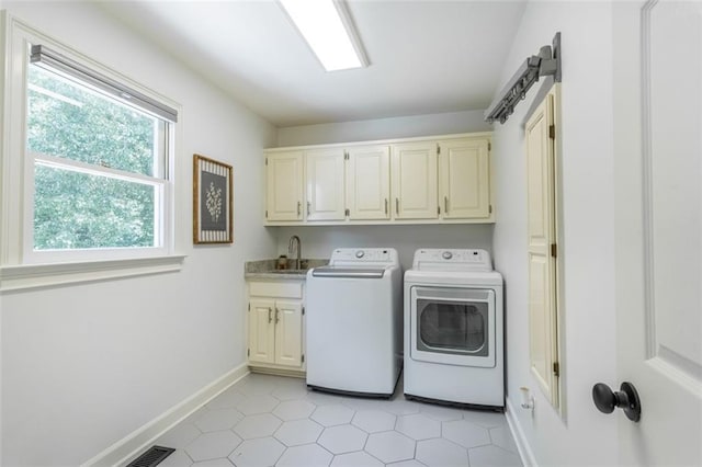 3664 Maple Forge Ln, Gainesville, GA 30504 - laundry room featuring washer and clothes dryer, cabinet space, and light tile patterned flooring
