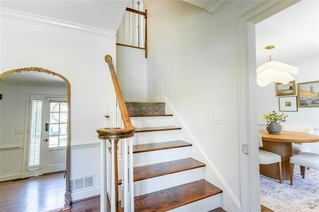3664 Maple Forge Ln, Gainesville, GA 30504 - stairway with crown molding, wood finished floors, and arched walkways