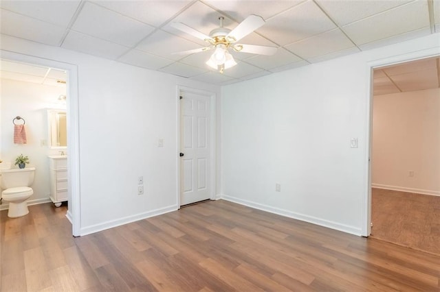 3664 Maple Forge Ln, Gainesville, GA 30504 - unfurnished bedroom with a paneled ceiling, wood finished floors, ensuite bathroom, and a ceiling fan