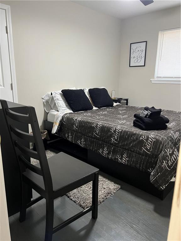 bedroom featuring wood finished floors