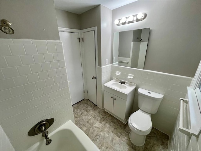 25 Gladstone Dr SW, Marietta, GA 30060 - bathroom with tile walls, vanity, tub / shower combination, and a wainscoted wall