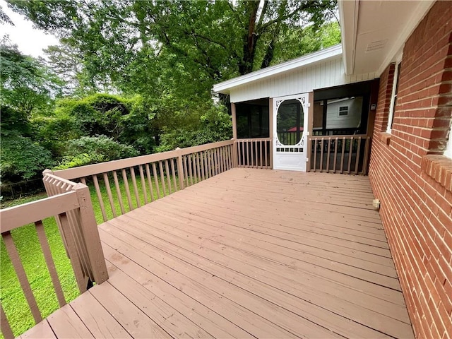 25 Gladstone Dr SW, Marietta, GA 30060 - wooden deck with a sunroom and view of wooded area
