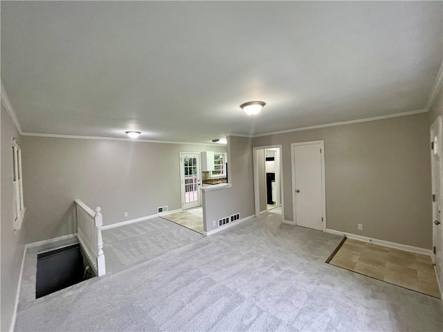25 Gladstone Dr SW, Marietta, GA 30060 - unfurnished living room featuring crown molding and light colored carpet
