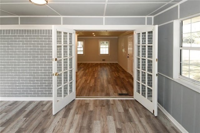 interior space featuring hardwood / wood-style flooring and french doors