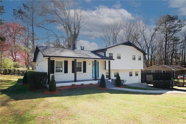 split level home with a front yard