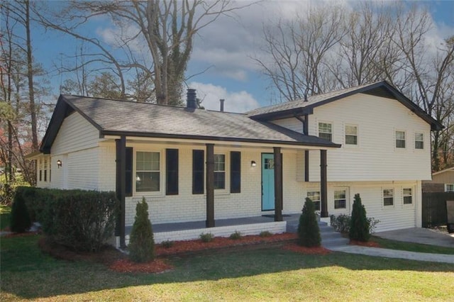 split level home with a front yard