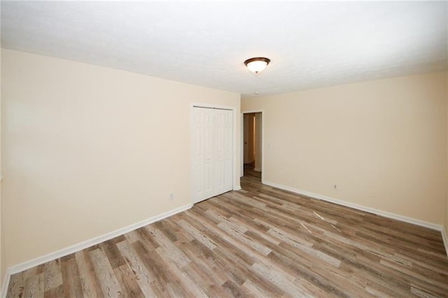 spare room featuring hardwood / wood-style flooring