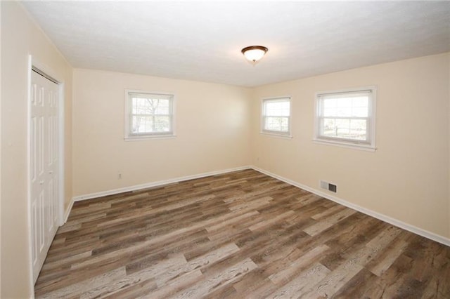 empty room featuring hardwood / wood-style flooring