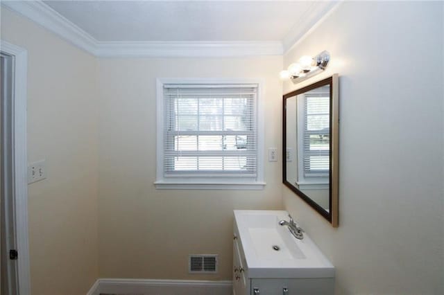 bathroom with vanity and ornamental molding