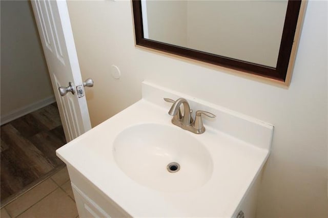 bathroom with vanity and hardwood / wood-style floors