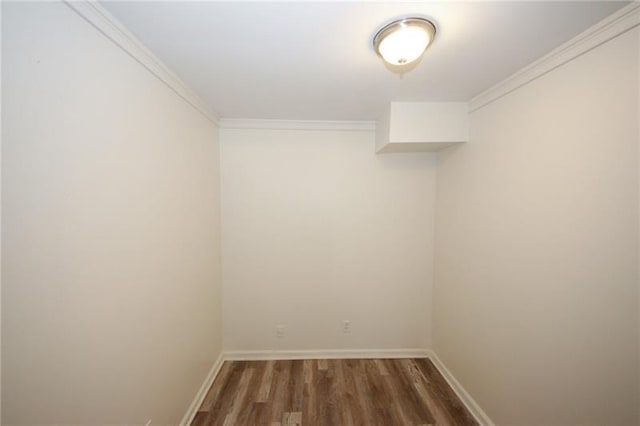 spare room featuring crown molding and wood-type flooring