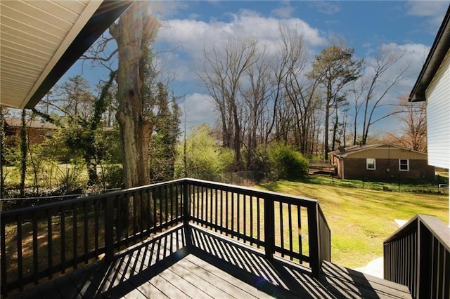 wooden deck with a yard