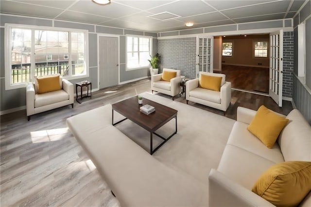 living room with hardwood / wood-style flooring and a healthy amount of sunlight