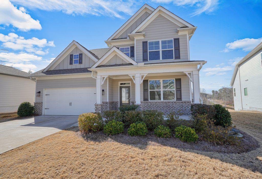 craftsman-style home featuring a garage and a porch