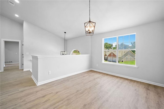 3156 Ozmer Lndg, Decatur, GA 30034 - empty room with a chandelier, wood finished floors, baseboards, lofted ceiling, and recessed lighting
