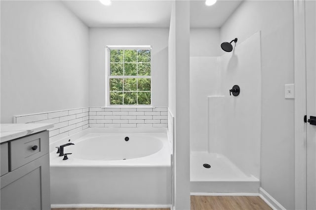 3156 Ozmer Lndg, Decatur, GA 30034 - bathroom with a bath, vanity, a shower, wood finished floors, and recessed lighting
