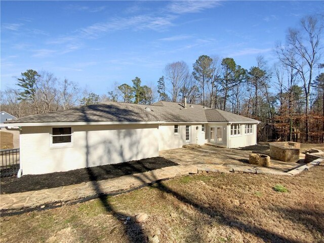 rear view of house featuring a patio area and french doors