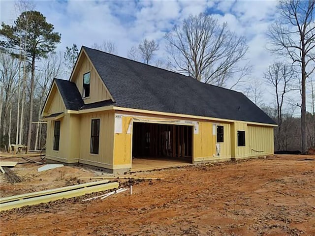 view of side of property with a garage