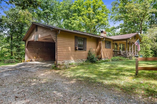 view of front of home featuring a front lawn and a chimney