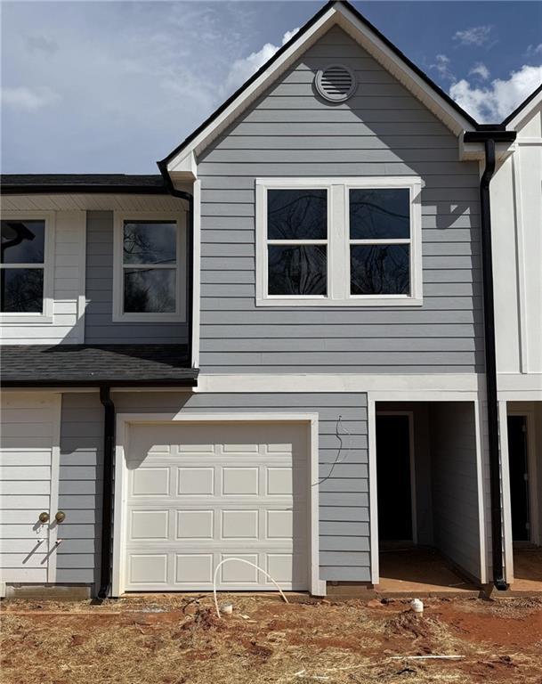 11596 E Lovejoy Rd, Hampton, GA 30228 - view of front facade featuring an attached garage