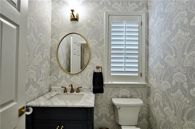 bathroom with vanity and toilet