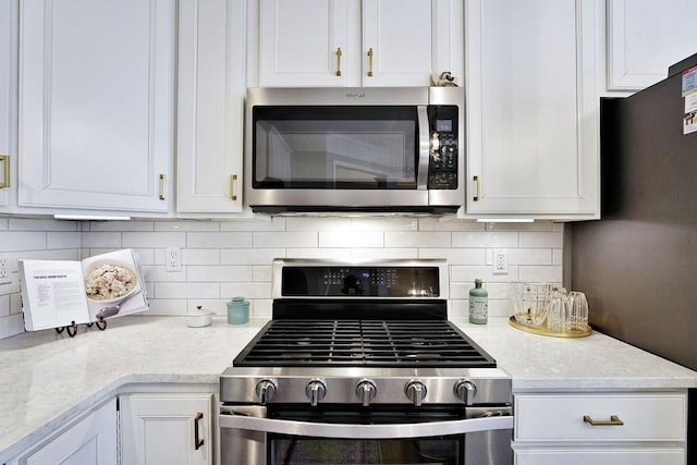 kitchen featuring white cabinets and stainless steel appliances