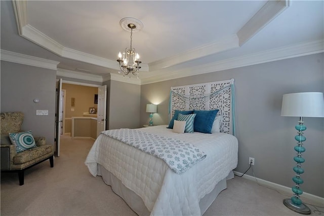 bedroom with an inviting chandelier, light colored carpet, ornamental molding, and a tray ceiling