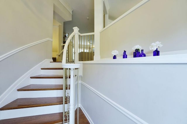 stairs with wood finished floors