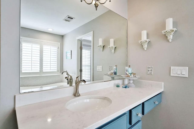 bathroom with visible vents and vanity