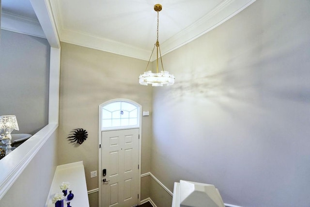 doorway with ornamental molding and an inviting chandelier