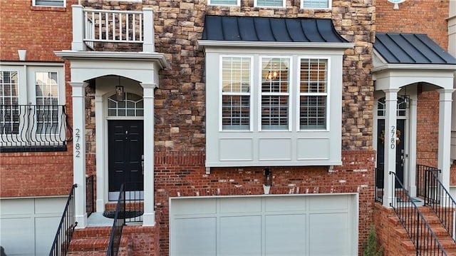 view of exterior entry featuring a garage