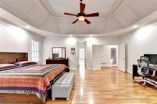 bedroom featuring ornamental molding, coffered ceiling, light wood-style flooring, and visible vents
