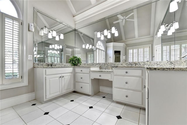 full bath featuring baseboards, a ceiling fan, and a wealth of natural light