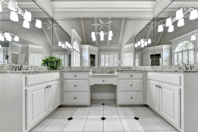 full bath with tile patterned floors, a notable chandelier, plenty of natural light, and lofted ceiling