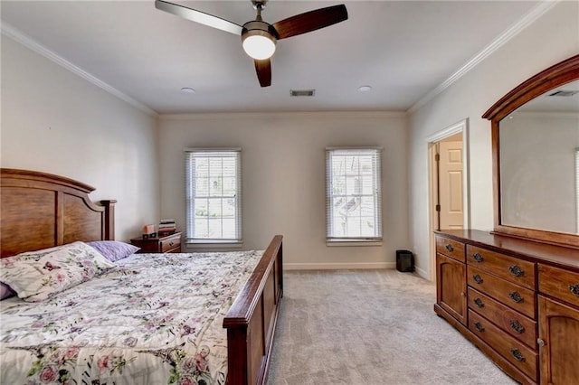 bedroom with crown molding, light colored carpet, baseboards, and visible vents
