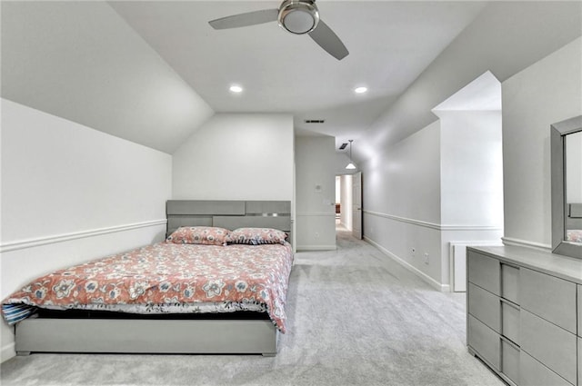 bedroom with carpet floors, baseboards, vaulted ceiling, and visible vents