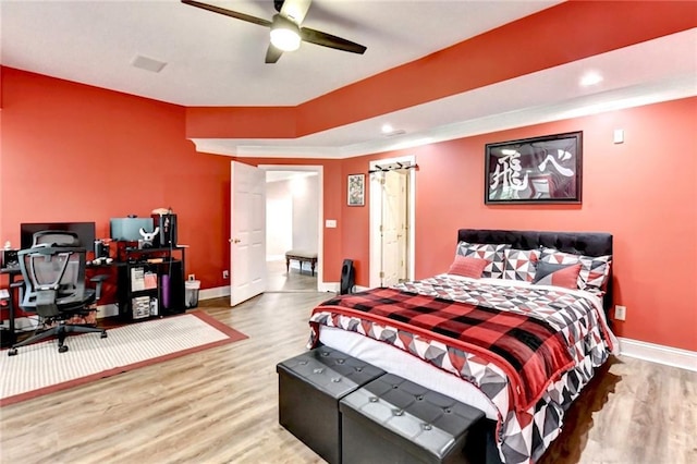 bedroom featuring baseboards, recessed lighting, ceiling fan, and wood finished floors